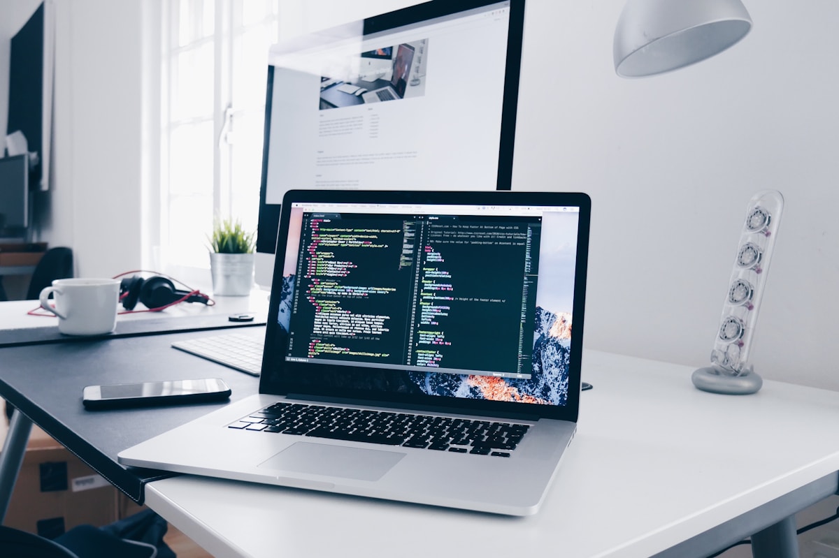 Developer working at a laptop in a software engineering workspace